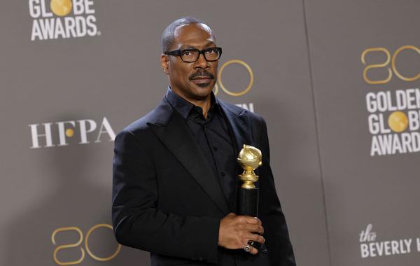Eddie Murphy poses with the Cecil B. Demille Award in the press room during the 80th Annual Golden Globe Awards at The Beverly Hilton on January 10, 2023 in Beverly Hills, California. Amy Sussman/Getty Images/AFP