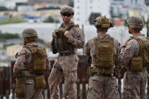 US Army patrols along the US-Mexico border with combat vehicles