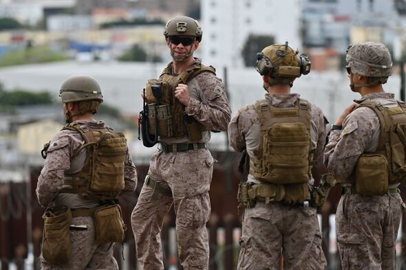 US Army patrols along the US-Mexico border with combat vehicles